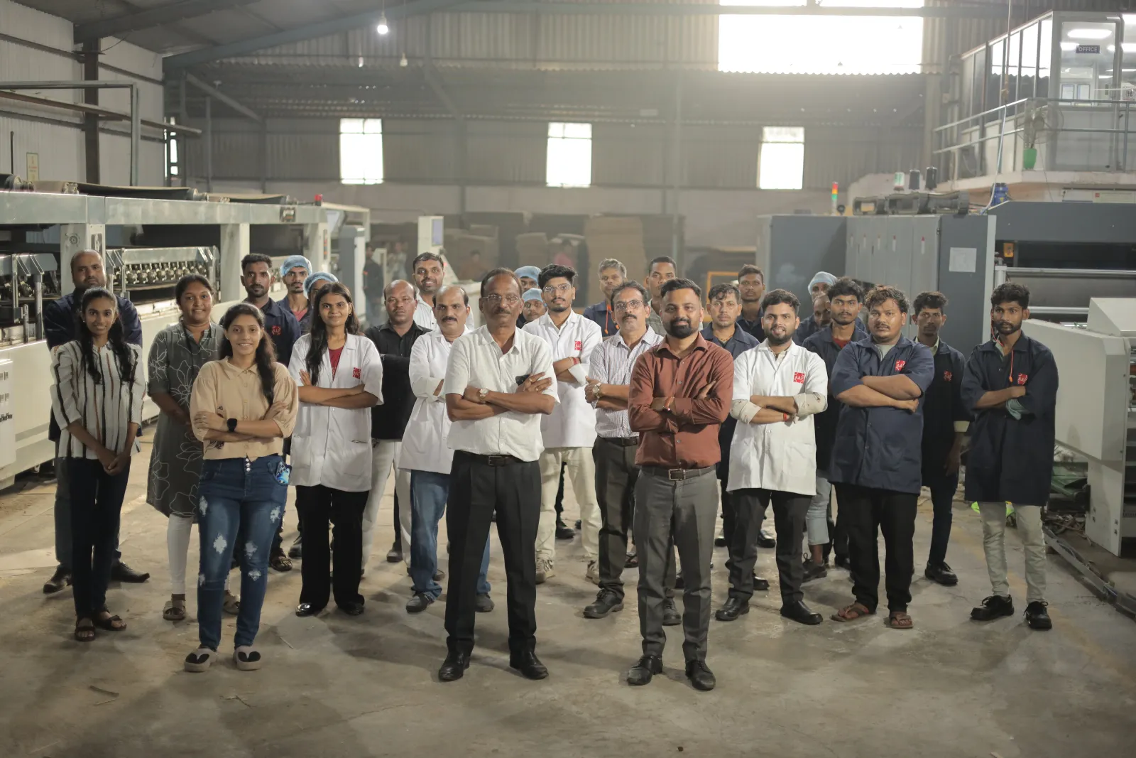 The Asian Packaging Industries team on the production floor in Vapi